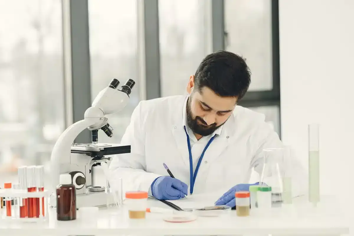 Doctor checking samples and writing notes of each of them