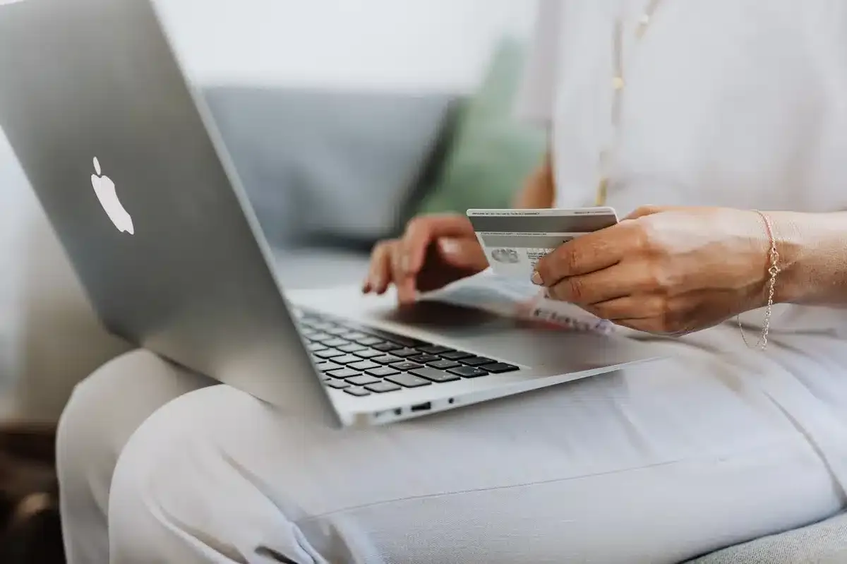 Person buying a product online with their credit card
