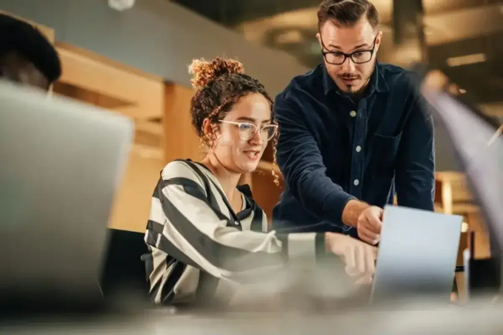 Hired web developers testing features on a newly completed website