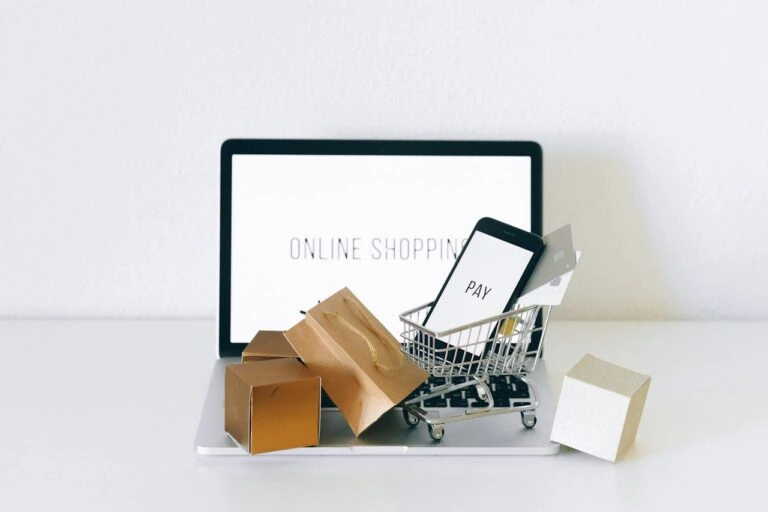 laptop with "online shopping" on the monitor