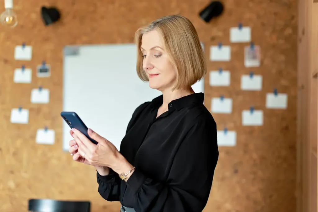 person using a phone to browse different websites