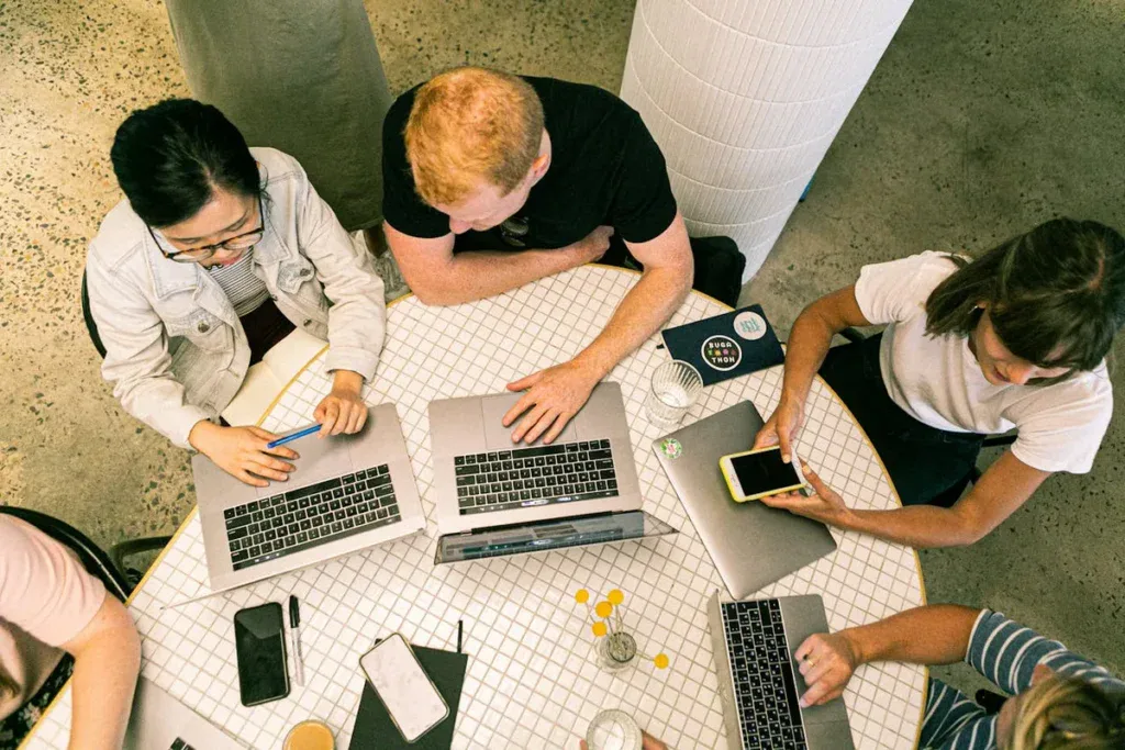 A group of people working together on one table