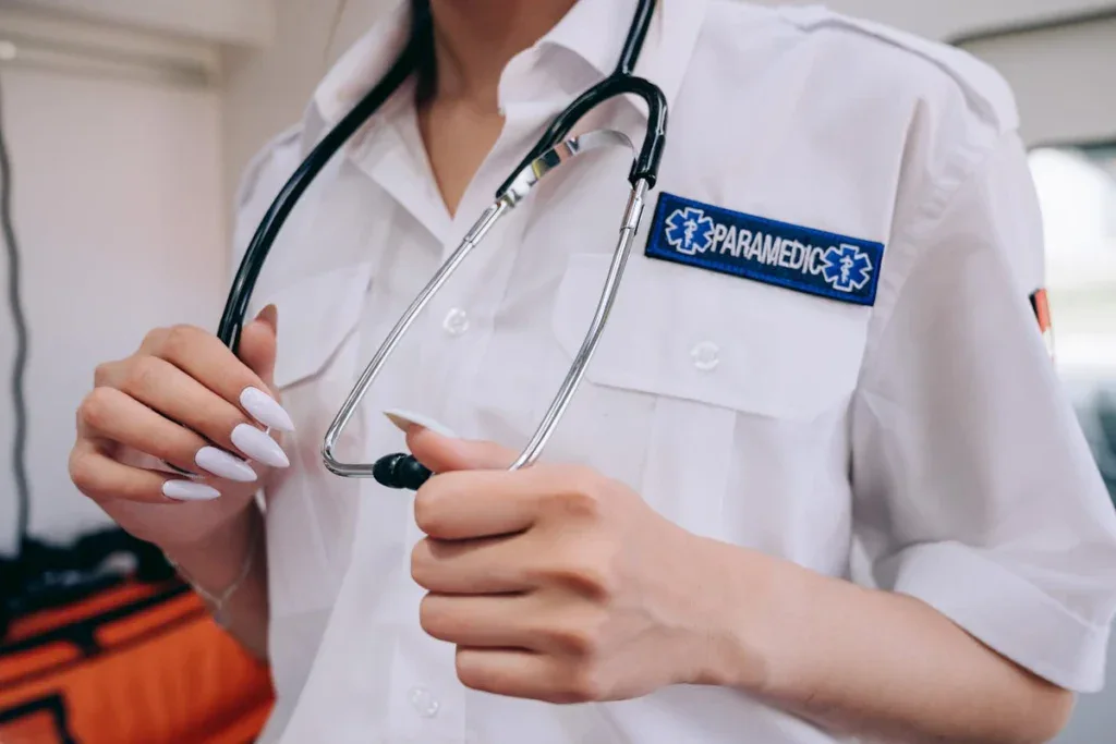 Paramedic woman touching her stethoscope