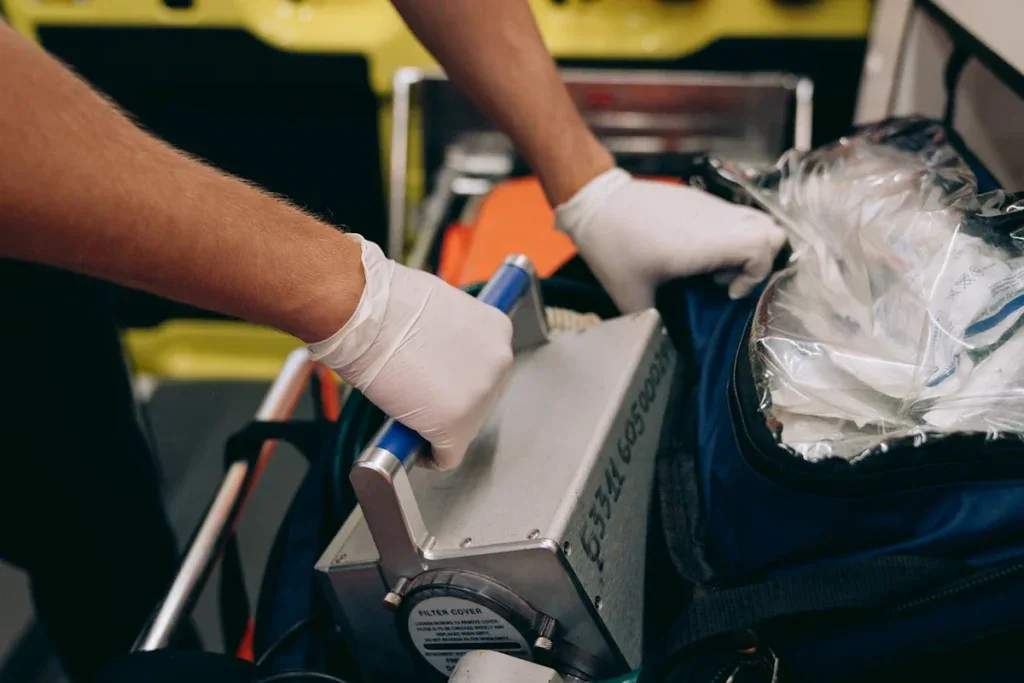 Paramedic handling medical equipment