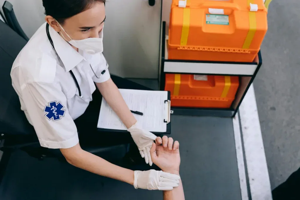A medic holding a patient hand