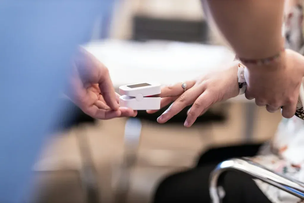 Patient getting their pulse taken
